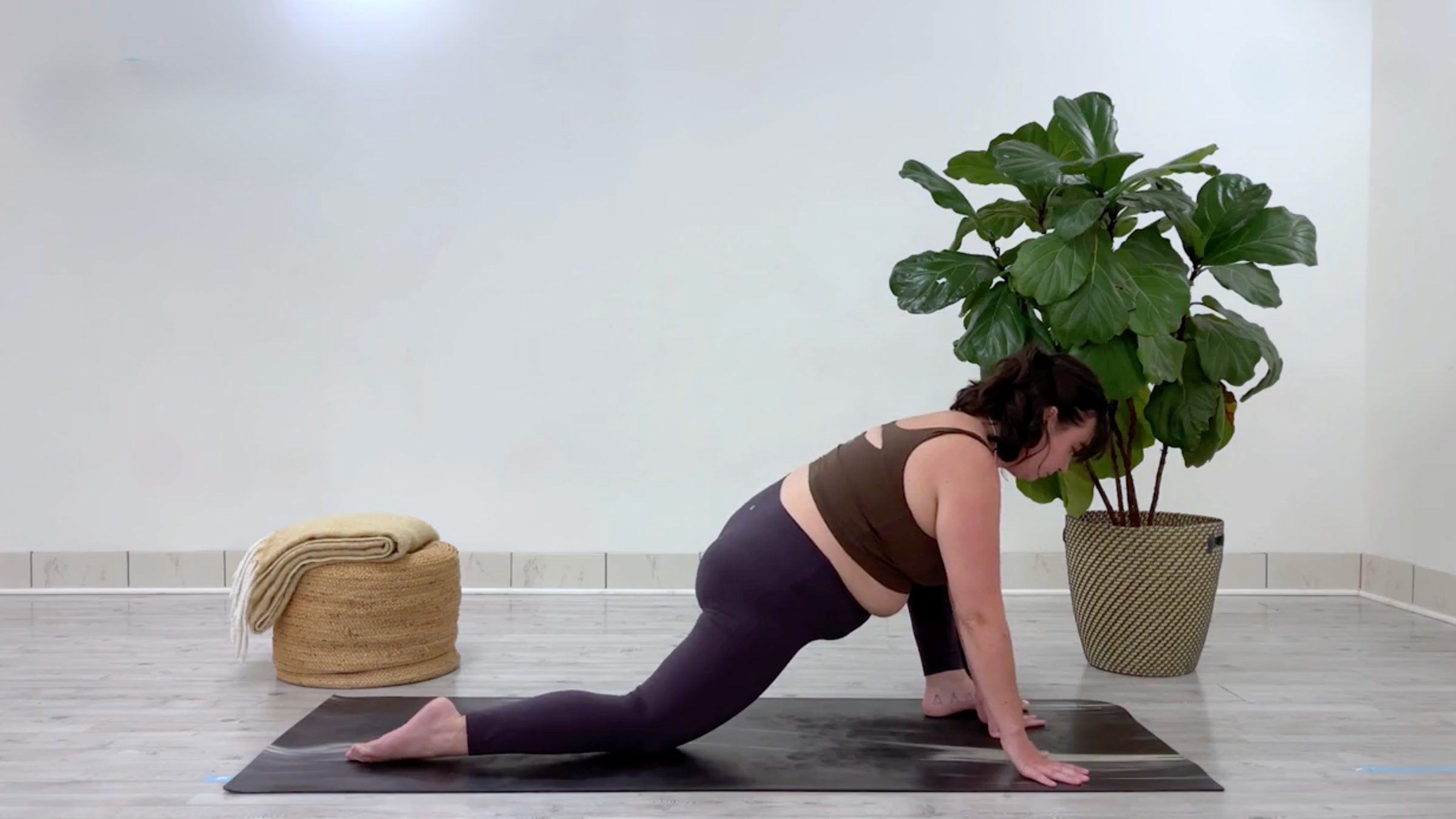 Taylor Lorenz in Lizard Post, part of her yoga for stress relief flow for back to school season